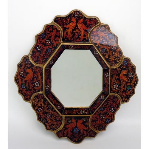 1019 - A Peruvian reverse painted wall mirror, with octagonal mirror plate enclosed by panels of birds and ... 