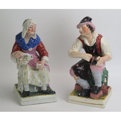 1046 - A pair of Staffordshire pottery figures 'The Cobbler and His Wife', 31cm high