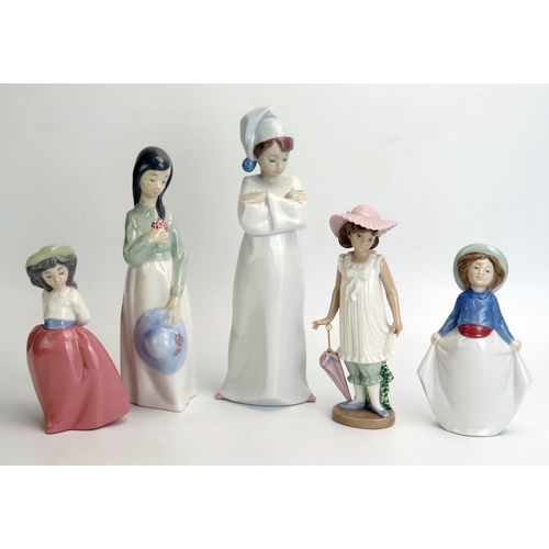 1047 - Lladro and Nao, five assorted porcelain figurines of young girls and boy in a night shirt. (5)No in ... 