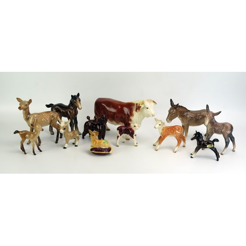 1074 - A collection of assorted Beswick animals, includes a Chihuahua, poodle, donkey, calf, foals, hind an... 