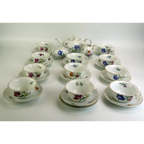 1075 - A Rosenthal porcelain part tea service with polychrome iris and convolvulus pattern decoration, incl... 