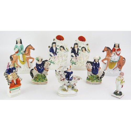 1093 - A collection of assorted miniature Staffordshire spill vases, figures on horseback and single figure... 