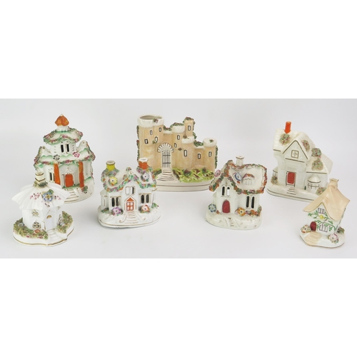 1094 - A collection of seven Staffordshire pastel burners in the form of castles and cottages