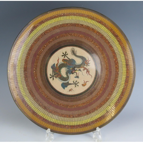 1333 - A Japanese cloisonné charger, the centre decorated with dragon chasing pearls, enclosed by banded de... 