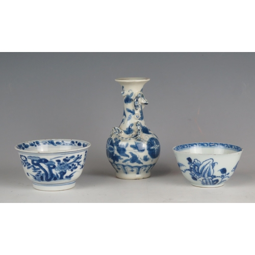 1338 - Two Chinese blue and white decorated tea bowls of traditional design together with a small blue and ... 