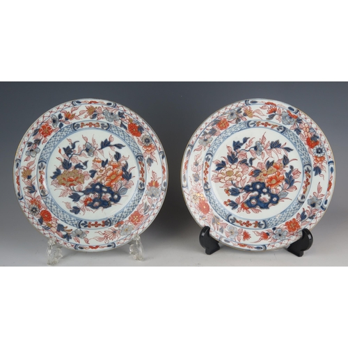 1339 - A pair of Chinese Imari porcelain plates, the floral decoration heightened with gilt, 23cm diameter.