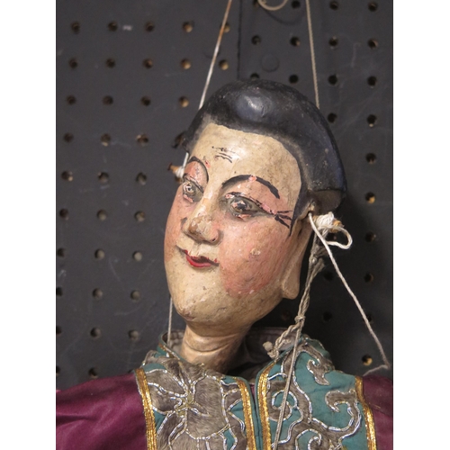 1344 - Two late 19th century carved wood and polychrome decorated strung puppets, having wood heads hand an... 