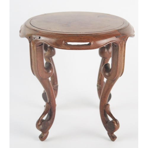 1350 - A Chinese polished hardwood stand of circular outline raised on four swept and pierced legs, 17cm di... 