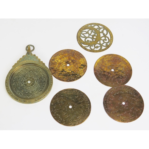 1395 - An Arabic Brass Circular Astrolabe with Arabic Script and Islamic Decoration, with four double-sided... 