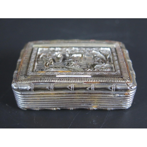 1418 - A Chinese carved tortoiseshell snuff box, the hinged lid and back decorated with figures in garden l... 