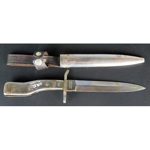 1458 - A German Demag Combination trench knife/bayonet, with 15cm double-edged blade with steel shaped grip... 