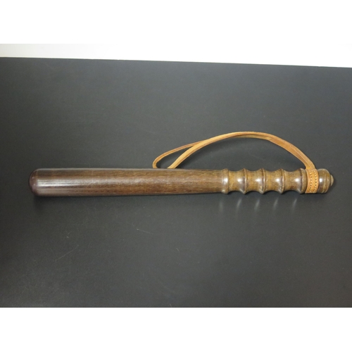 1475 - A Devon Constabulary hardwood truncheon, with ring turned handle, with leather  strap, impressed Dev... 