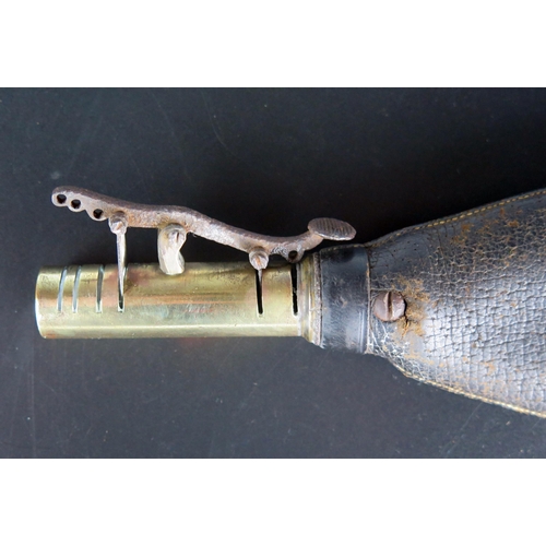 1482 - A 19th century brass and leather shot flask, 22cm long.