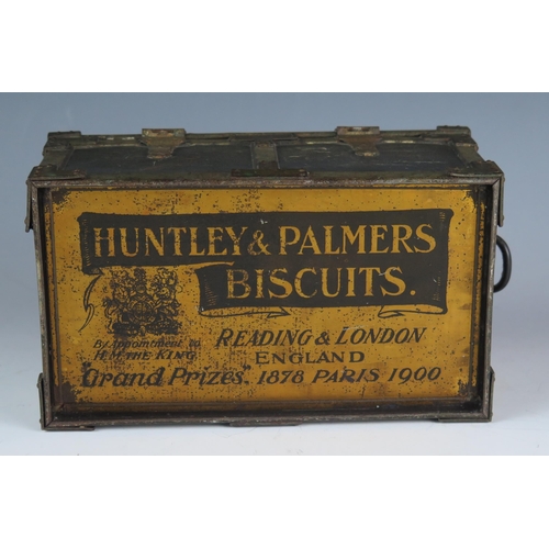 1489 - Huntley & Palmer, an Edwardian biscuit tin in the form of a travelling trunk, with lithographed deta... 