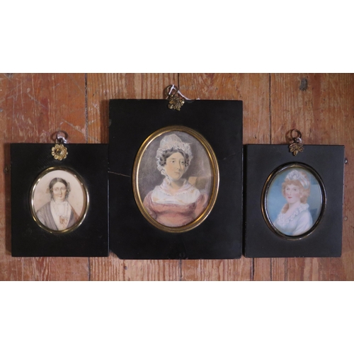 1557 - Three 19th century miniature paintings of women, contained in ebony frames,, one painted on ivory (E... 