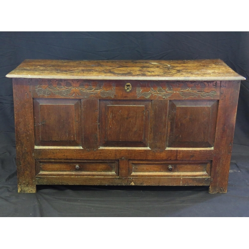 1574 - A late 18th century oak mule chest, of rectangular outline, with hinged lid, triple panelled front w... 