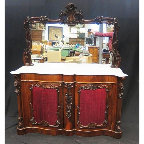 1577 - A Victorian rosewood sideboard, with an arched mirror back with foliate crest, the double serpentine... 