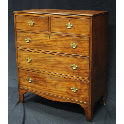 1579 - A late Georgian mahogany rectangular chest containing two short and three long graduated drawers, on... 