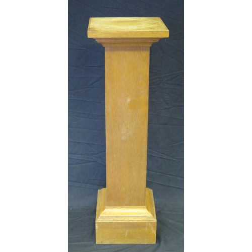 1585 - Two assorted oak torcheres of square form mounted on plinth bases, 99cm and 102cm high. (2).