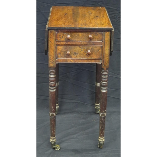 1587 - A 19th century oak side table, the top with two hinged leaves, and two short drawers, raised on ring... 