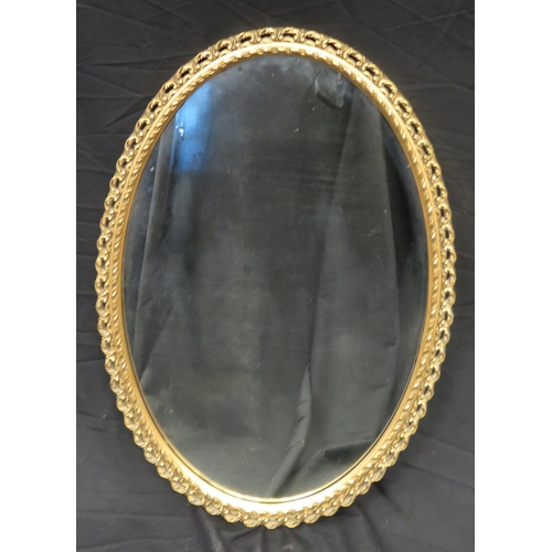 1604 - A gilt plaster framed oval wall mirror, 81 x 55cm