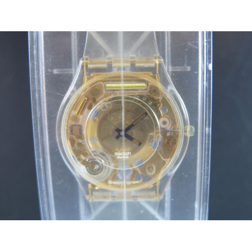 431 - A SWATCH Watch Golden Jelly Skin SFK101. Boxed and appears unworn