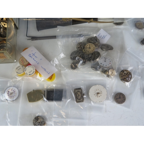 436 - A Selection of Watch Parts including eight new balance wheels and a 19th century clock