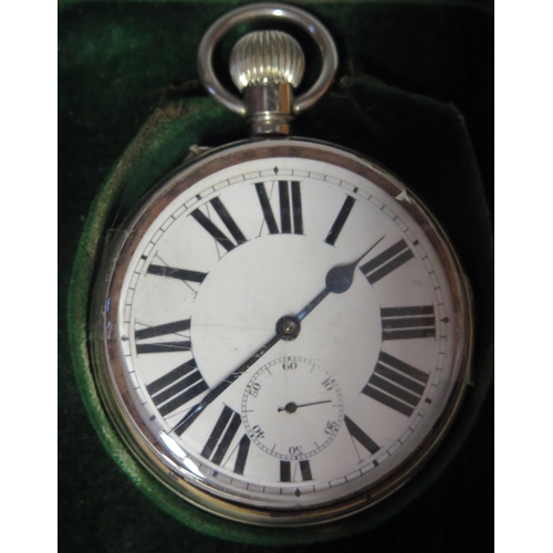 694 - A goliath steel cased pocket watch  with 6cm Roman dial with subsidiary seconds dial contained in a ... 