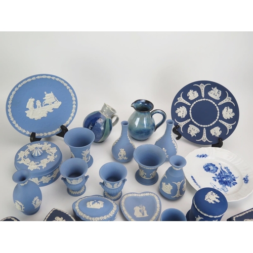 1117 - A collection of Wedgwood jasperware vases, plates, eggs and covers, and other ceramics