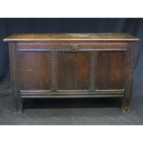 1620 - A 19th century oak coffer, the rectangular top with a moulded edge above a triple panelled front, ra... 