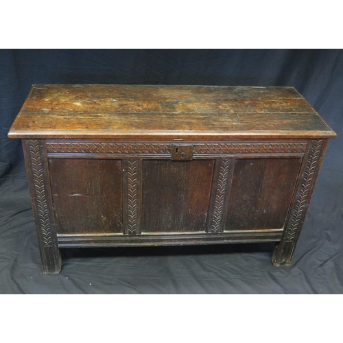 1620 - A 19th century oak coffer, the rectangular top with a moulded edge above a triple panelled front, ra... 