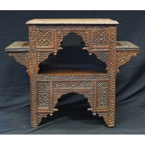 1623 - A Liberty style Moorish carved hardwood occasional table, the rectangular top with carved central me... 