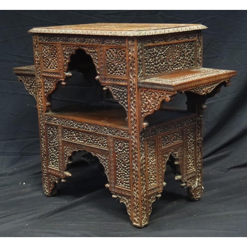 1623 - A Liberty style Moorish carved hardwood occasional table, the rectangular top with carved central me... 