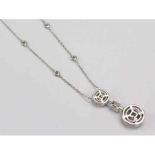 1 - A Middle Eastern 18ct White Gold and Diamond Pendant on integral chain set with brilliant round, pri... 