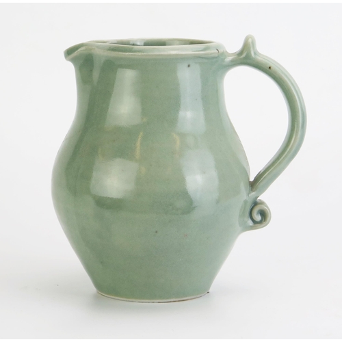 1028 - DAVID LEACH (1911-2005) for Lowerdown Pottery Porcelain Water Jug in a sea green glaze with scroll d... 