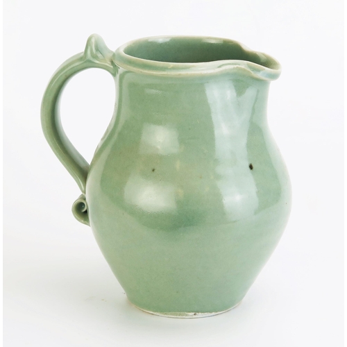 1028 - DAVID LEACH (1911-2005) for Lowerdown Pottery Porcelain Water Jug in a sea green glaze with scroll d... 