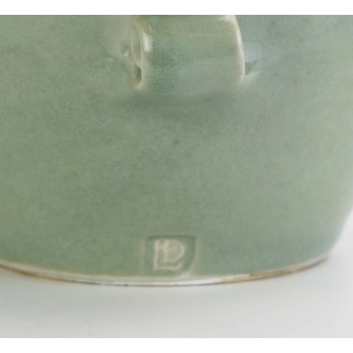 1028 - DAVID LEACH (1911-2005) for Lowerdown Pottery Porcelain Water Jug in a sea green glaze with scroll d... 