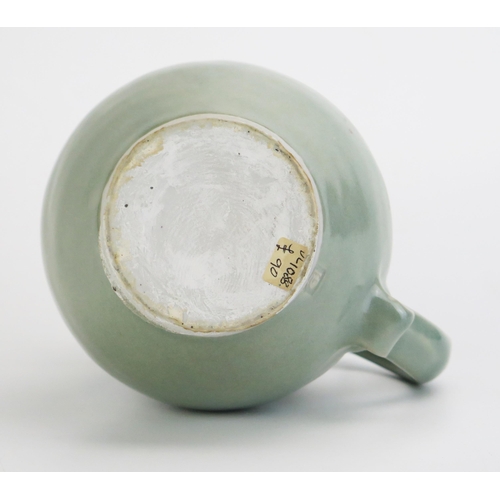 1028 - DAVID LEACH (1911-2005) for Lowerdown Pottery Porcelain Water Jug in a sea green glaze with scroll d... 