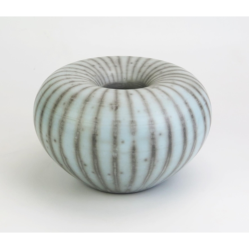 1039 - TIM ANDREWS (born 1960) Raku Humbug Form, burnished and smoke fired duck egg blue surface, impressed... 