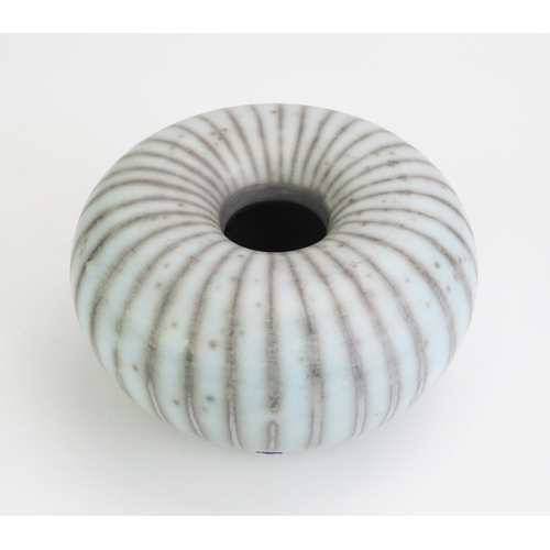 1039 - TIM ANDREWS (born 1960) Raku Humbug Form, burnished and smoke fired duck egg blue surface, impressed... 