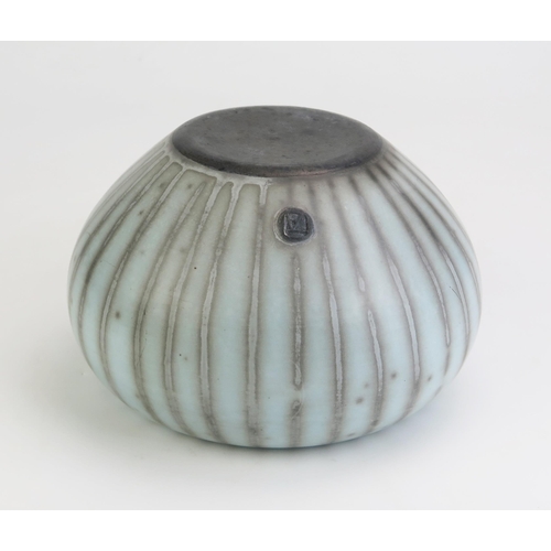 1039 - TIM ANDREWS (born 1960) Raku Humbug Form, burnished and smoke fired duck egg blue surface, impressed... 