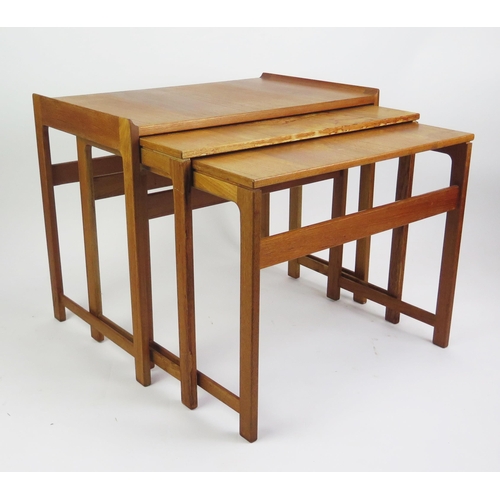 1051 - A 1960's Danish Teak Nest of Three Tables, MADE IN DENMARK stamped mark to the smallest, largest 60(... 