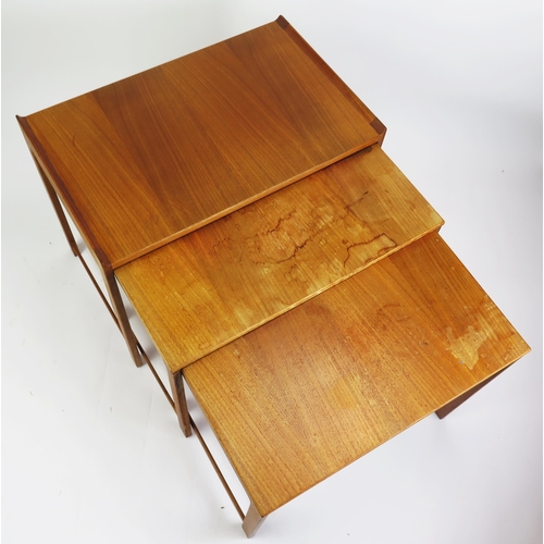 1051 - A 1960's Danish Teak Nest of Three Tables, MADE IN DENMARK stamped mark to the smallest, largest 60(... 