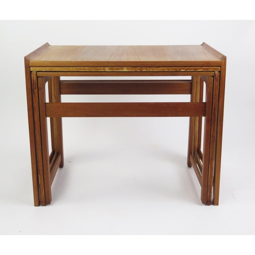 1051 - A 1960's Danish Teak Nest of Three Tables, MADE IN DENMARK stamped mark to the smallest, largest 60(... 