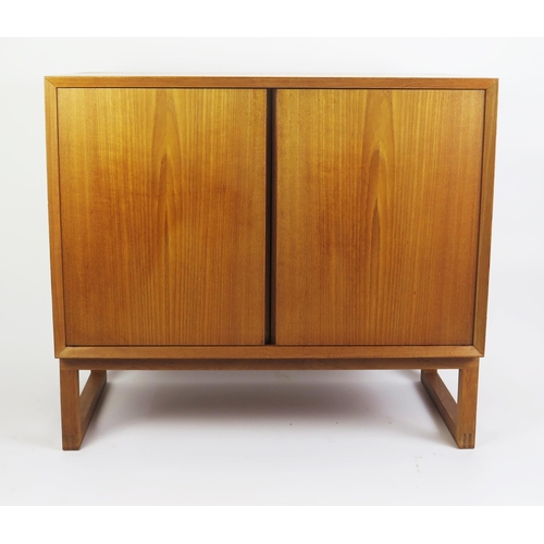 1052 - A 1960's Danish Teak Two Door Cabinet with single adjustable shelf, stamped MADE IN DENMARK, 80(l)x4... 