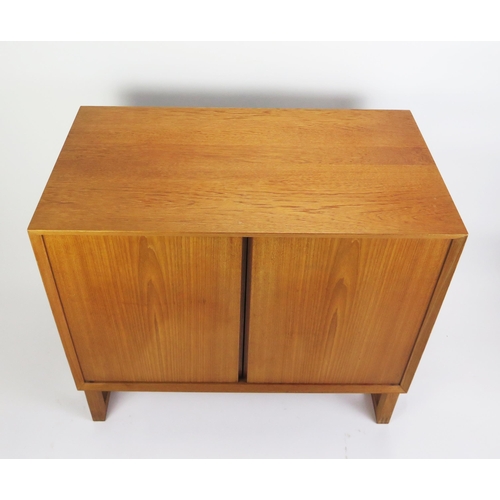 1052 - A 1960's Danish Teak Two Door Cabinet with single adjustable shelf, stamped MADE IN DENMARK, 80(l)x4... 