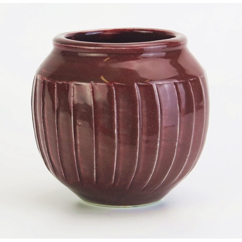 1057 - DAVID LEACH (1911-2005) for Lowerdown Pottery fluted vase, sang de boeuf glaze, impressed DL mark to... 