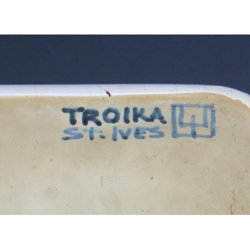 1058 - A Rare and Early Troika Pottery Dish of rectangular form with dark blue scarab decoration and rim, 