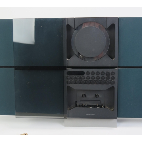 1064 - A Bang & Olufsen Beosound Century Stereo with remote control and instructions

Provenance _ see lot ... 