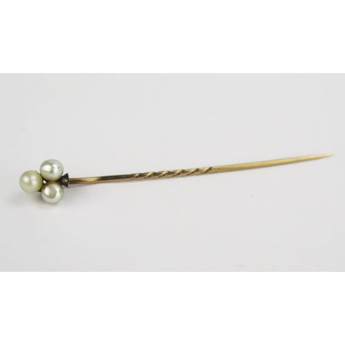 107 - A Victorian Pearl or Cultured Pearl and Rose Cut Diamond Precious Yellow Metal Stick Pin in a Hunt &... 